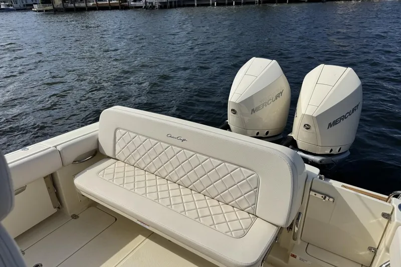 Slide: The Image of 2023 Chris-Craft Catalina 30 boat with dual Mercury engines and quilted seating. - 6