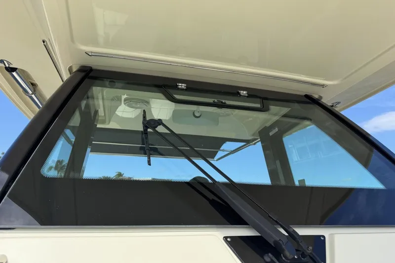 Slide: The Image of 2023 Chris-Craft Catalina 30 windshield with wiper, showcasing sleek design and functionality. - 8