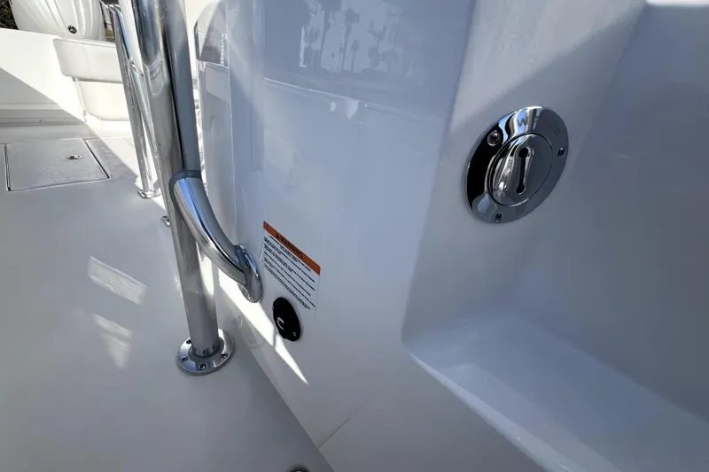 Slide: The Image of 2026 Contender 25 Tournament boat interior with chrome details and safety features. - 13