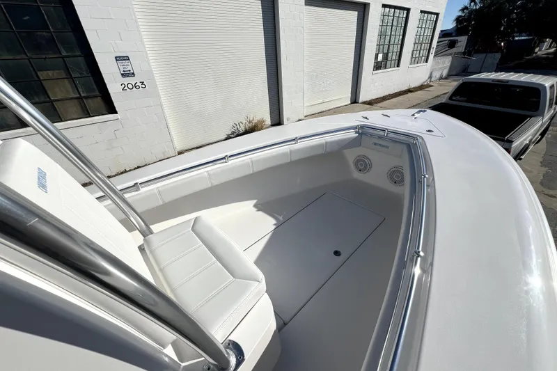 Slide: The Image of 2026 Contender 25 Tournament boat with sleek white seating and modern design. - 14