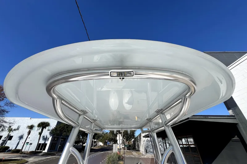 Slide: The Image of 2026 Contender 25 Tournament boat T-top against clear blue sky. - 19