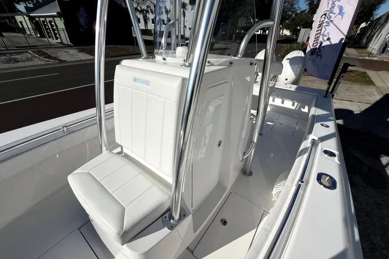 Slide: The Image of 2026 Contender 25 Tournament boat interior with sleek white seating and stainless steel accents. - 20