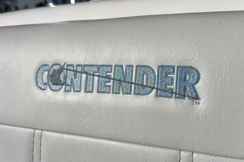 Slide: The Image of Contender 25 Tournament 2026 logo on white leather upholstery. - 22