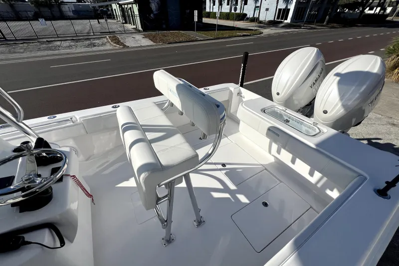 Slide: The Image of 2026 Contender 25 Tournament boat interior with dual Yamaha engines, sleek seating, and modern design. - 23