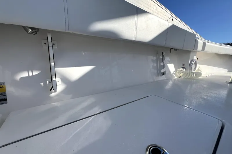 Slide: The Image of 2026 Contender 25 Tournament boat interior with sleek white finish and storage compartments. - 29