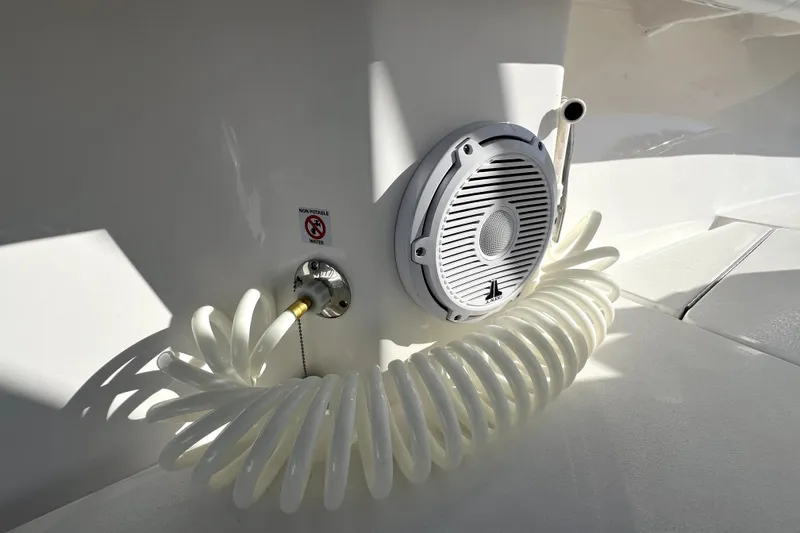 Slide: The Image of 2026 Contender 25 Tournament boat with coiled hose and speaker detail. - 30