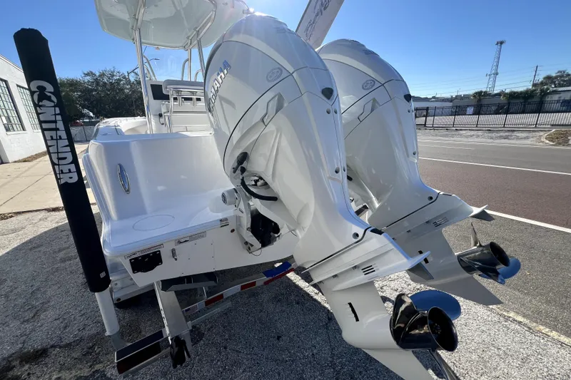 Slide: The Image of 2026 Contender 25 Tournament boat with dual Yamaha outboard engines, parked on a trailer. - 35