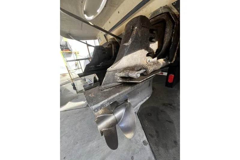 Slide: The Image of 2005 Larson Cabrio 290 boat propeller and stern drive close-up. - 11