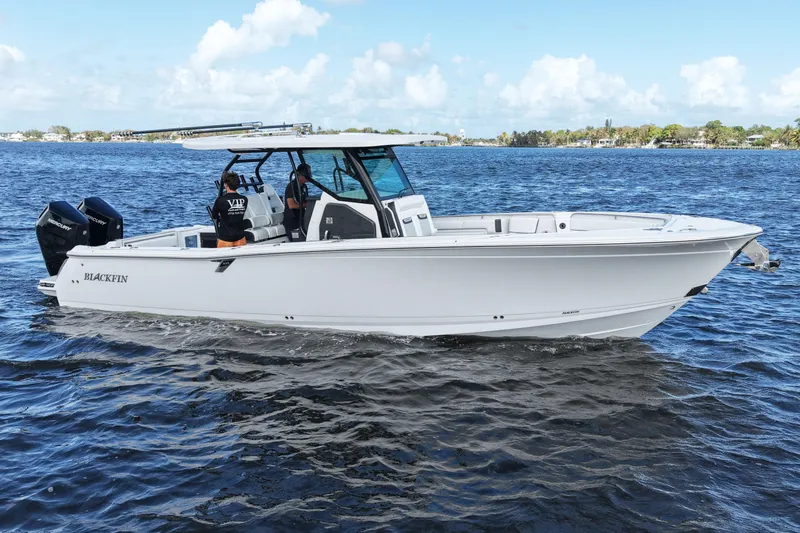 Slide: The Image of 2026 Blackfin 332 CC boat cruising on a sunny day. - 16