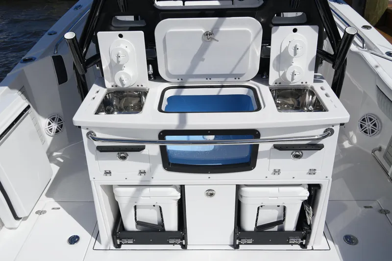 Slide: The Image of 2026 Blackfin 332 CC boat interior with dual sinks and storage compartments. - 20