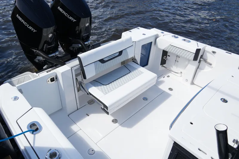 Slide: The Image of 2026 Blackfin 332 CC boat with dual Mercury engines on water. - 29