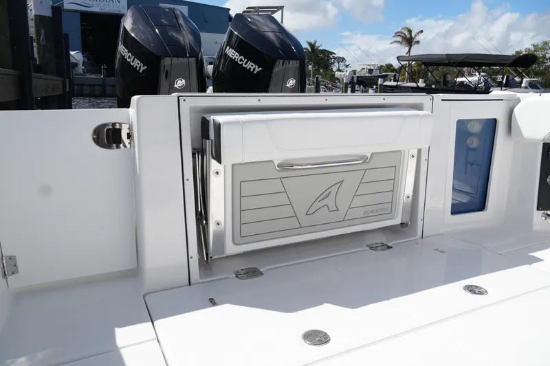 Slide: The Image of 2026 Blackfin 332 CC boat deck with Mercury engines and storage compartment. - 31