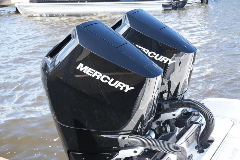 Slide: The Image of Twin Mercury outboard engines on a 2026 Blackfin 332 CC boat. - 33