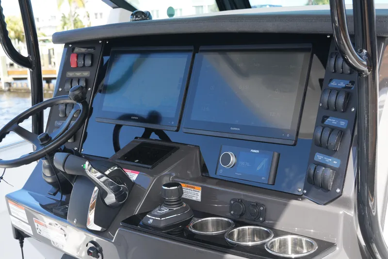 Slide: The Image of 2026 Blackfin 332 CC boat dashboard with advanced navigation and control systems. - 36