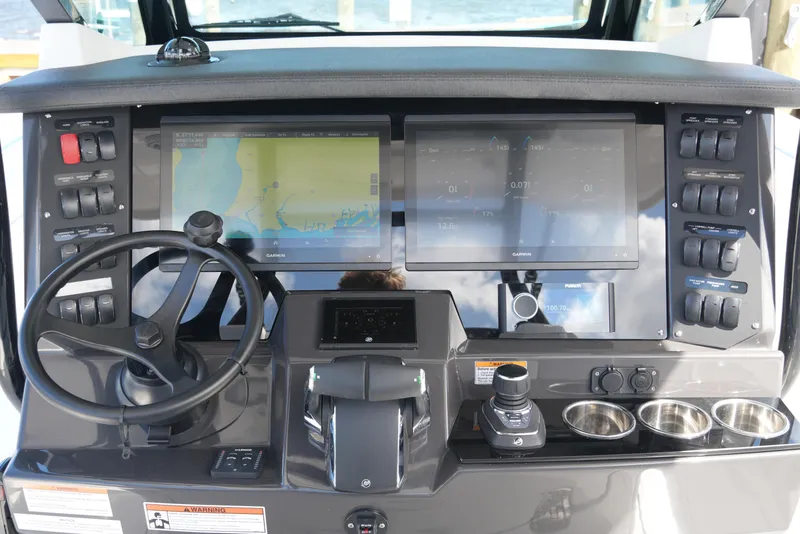 Slide: The Image of 2026 Blackfin 332 CC boat dashboard with advanced navigation and control systems. - 38