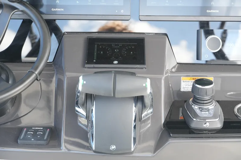 Slide: The Image of 2026 Blackfin 332 CC helm with advanced Garmin navigation and control systems. - 40