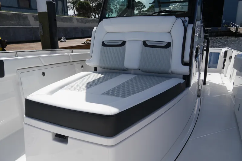Slide: The Image of 2026 Blackfin 332 CC boat with luxurious white seating and sleek design. - 49