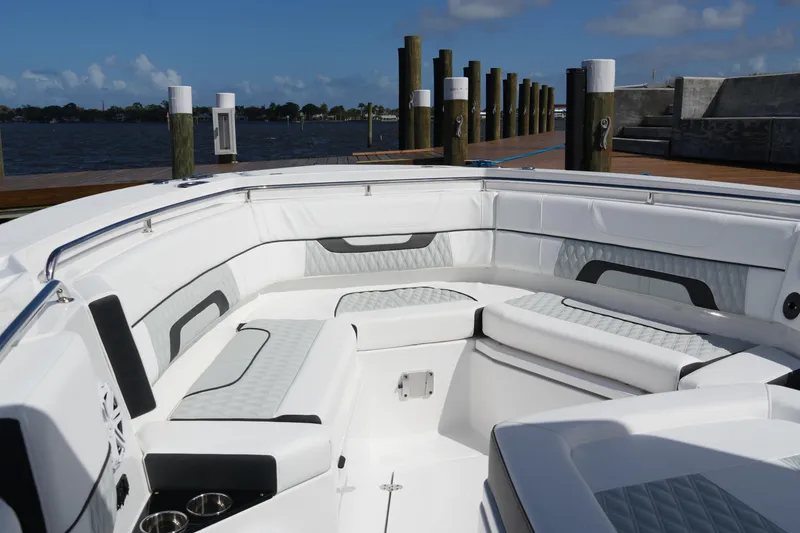 Slide: The Image of Luxurious seating area on a 2026 Blackfin 332 CC boat docked by the water. - 51