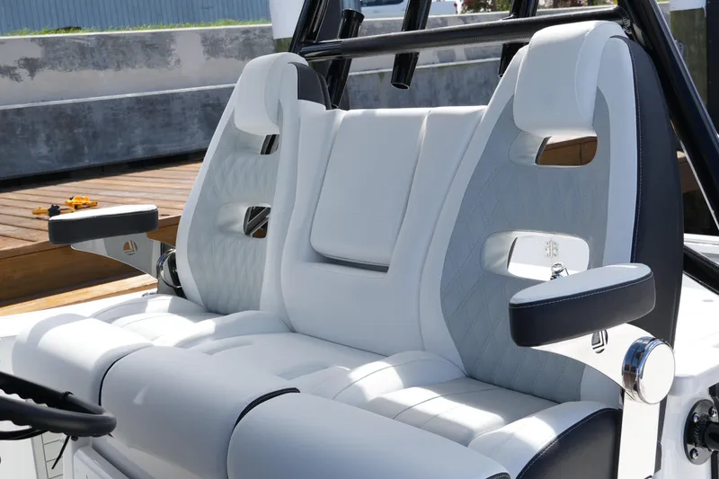 Slide: The Image of Luxurious seating on 2026 Blackfin 332 CC boat, featuring white and gray upholstery. - 61