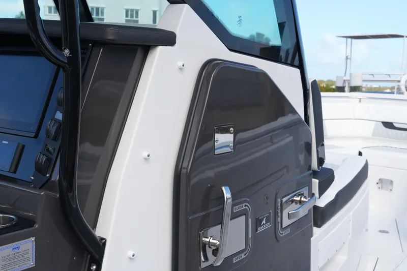 Slide: The Image of 2026 Blackfin 332 CC boat console with sleek design and modern controls. - 64