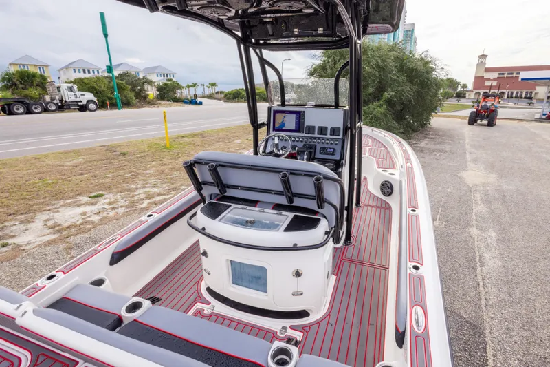 Slide: The Image of 2018 ShearWater 26 Carolina boat interior with modern dashboard and seating. - 11