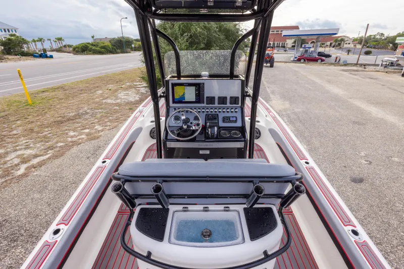 Slide: The Image of 2018 ShearWater 26 Carolina boat interior with steering console and navigation equipment. - 12