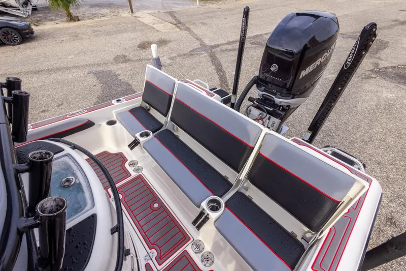 Slide: The Image of 2018 ShearWater 26 Carolina boat with Mercury engine and seating area. - 13