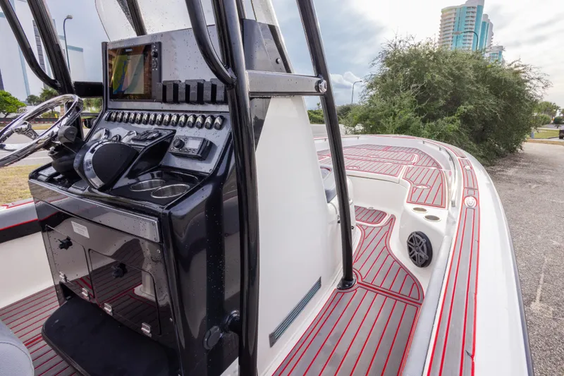 Slide: The Image of 2018 ShearWater 26 Carolina boat interior with modern control panel and sleek design. - 22