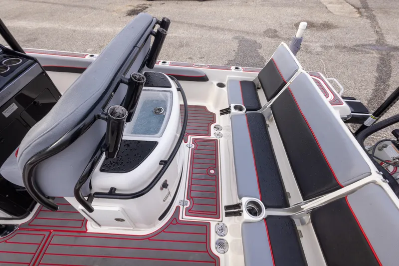 Slide: The Image of 2018 ShearWater 26 Carolina boat interior with seating and rod holders. - 25