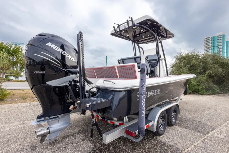 Slide: The Image of 2018 ShearWater 26 Carolina boat with Mercury Verado engine on trailer. - 3