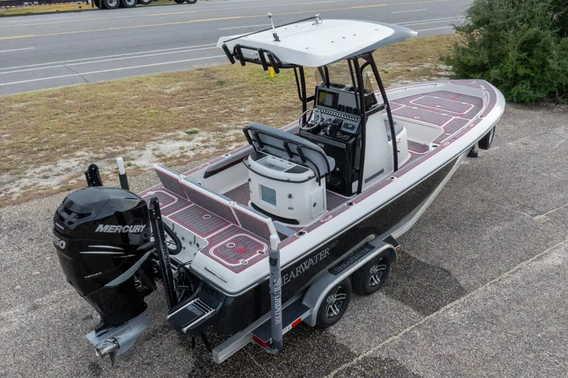 Slide: The Image of 2018 ShearWater 26 Carolina boat with Mercury engine on trailer, parked near road. - 33