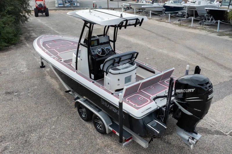 Slide: The Image of 2018 ShearWater 26 Carolina boat with Mercury engine, parked on a trailer. - 35