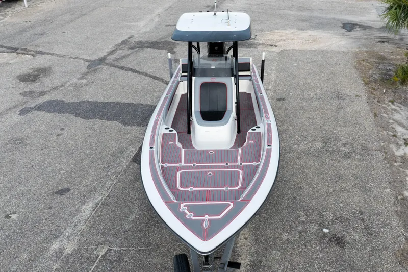 Slide: The Image of 2018 ShearWater 26 Carolina boat, aerial view, docked on concrete surface. - 38