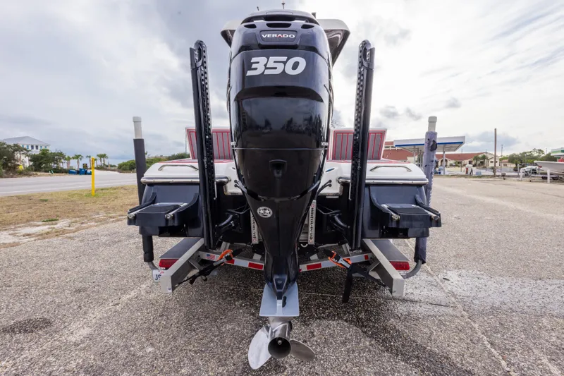 Slide: The Image of 2018 ShearWater 26 Carolina boat with powerful Verado 350 engine, parked on a trailer. - 4