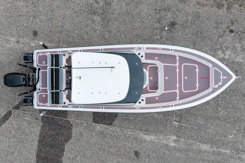 Slide: The Image of Overhead view of 2018 ShearWater 26 Carolina boat on concrete surface. - 43
