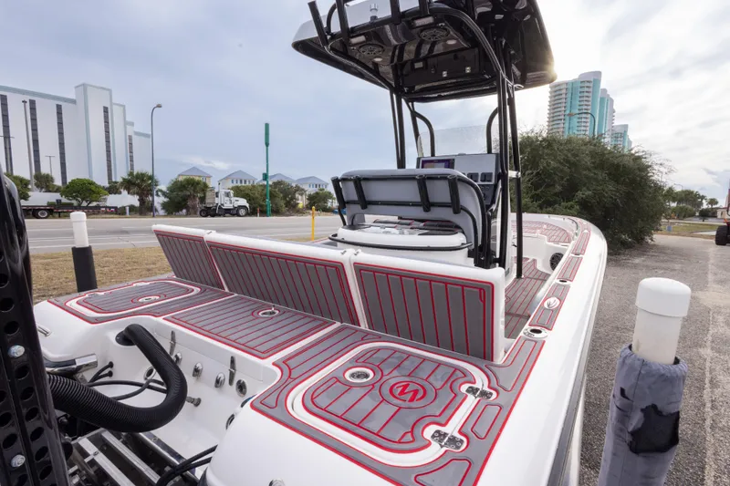 Slide: The Image of 2018 ShearWater 26 Carolina boat with sleek design and modern features, docked near buildings. - 44