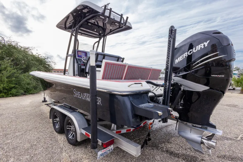 Slide: The Image of 2018 ShearWater 26 Carolina boat with Mercury Verado engine on trailer. - 5