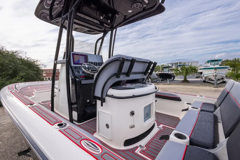 Slide: The Image of 2018 ShearWater 26 Carolina boat interior with modern console and seating. - 9