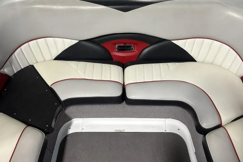 Slide: The Image of 2015 Malibu Wakesetter 247 LSV interior seating with red, black, and white upholstery. - 14