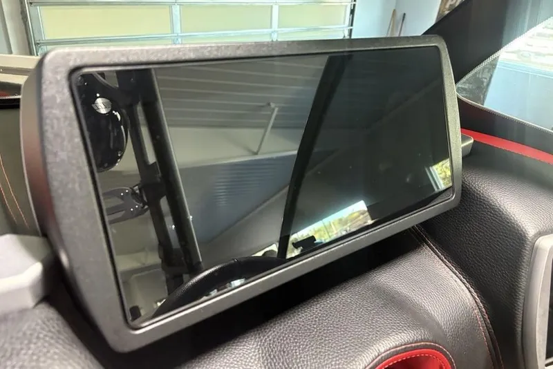 Slide: The Image of Dashboard display of a 2015 Malibu Wakesetter 247 LSV boat, featuring a sleek black screen. - 20