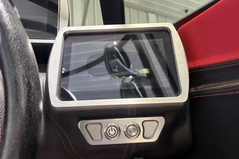 Slide: The Image of Dashboard of a 2015 Malibu Wakesetter 247 LSV with touchscreen and controls. - 23