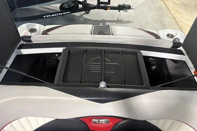 Slide: The Image of 2015 Malibu Wakesetter 247 LSV boat interior with open storage compartments. - 31