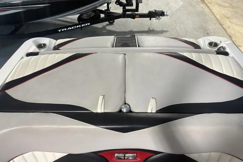 Slide: The Image of 2015 Malibu Wakesetter 247 LSV boat interior with sleek upholstery and cup holders. - 32