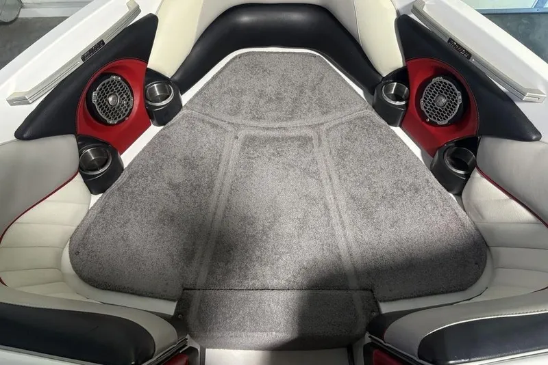 Slide: The Image of Interior of 2015 Malibu Wakesetter 247 LSV boat with speakers and cup holders. - 4