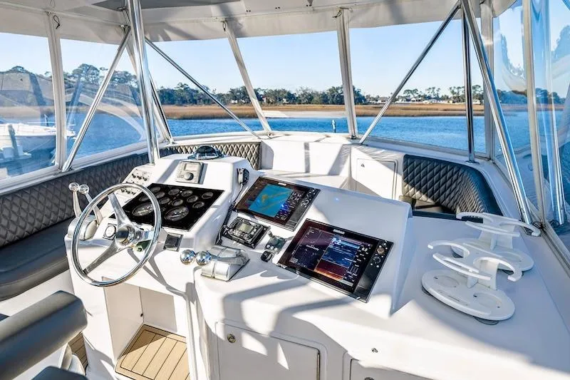 Slide: The Image of Cockpit of 1991 Ocean Yachts 53 Super Sport with modern navigation equipment. - 19