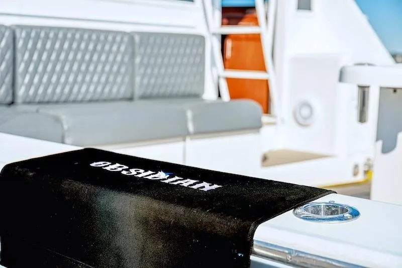 Slide: The Image of 1991 Ocean Yachts 53 Super Sport interior with seating and branded towel. - 25