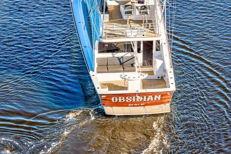 Slide: The Image of Ocean Yachts 1991 53 Super Sport boat named "Obsidian" cruising on water. - 3