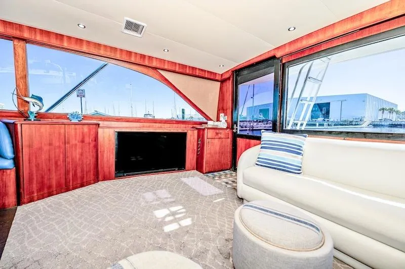 Slide: The Image of Luxurious interior of 1991 Ocean Yachts 53 Super Sport with elegant wood finish and plush seating. - 33
