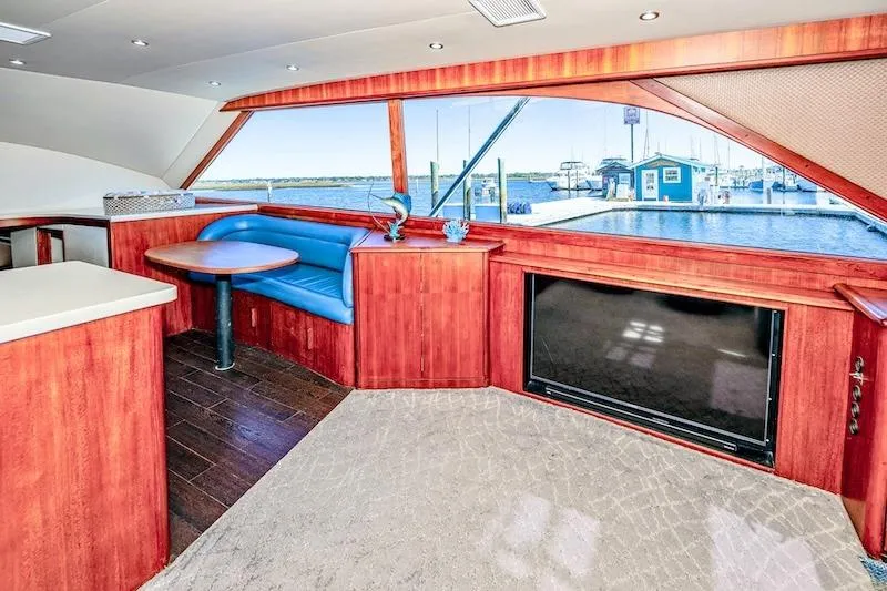 Slide: The Image of Interior of 1991 Ocean Yachts 53 Super Sport with wood finish and marina view. - 35
