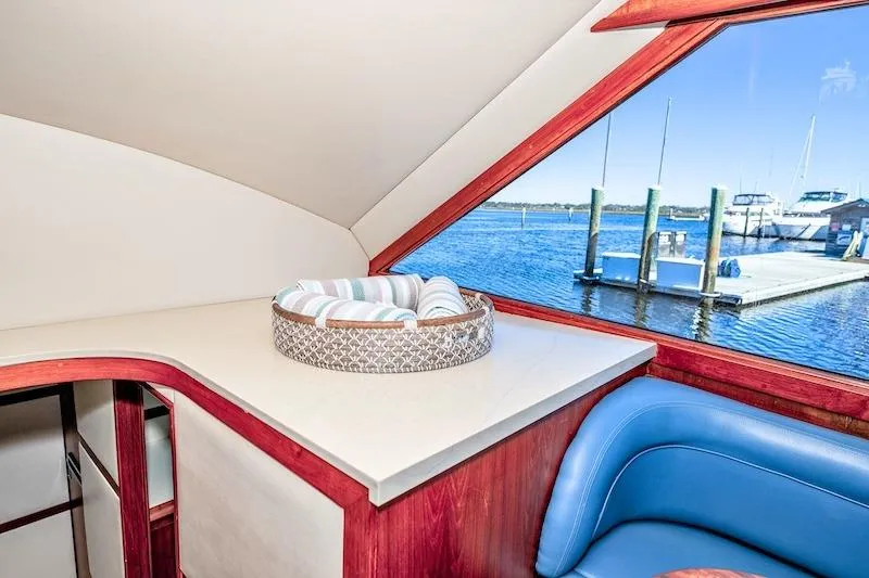 Slide: The Image of Interior of 1991 Ocean Yachts 53 Super Sport with marina view through window. - 39